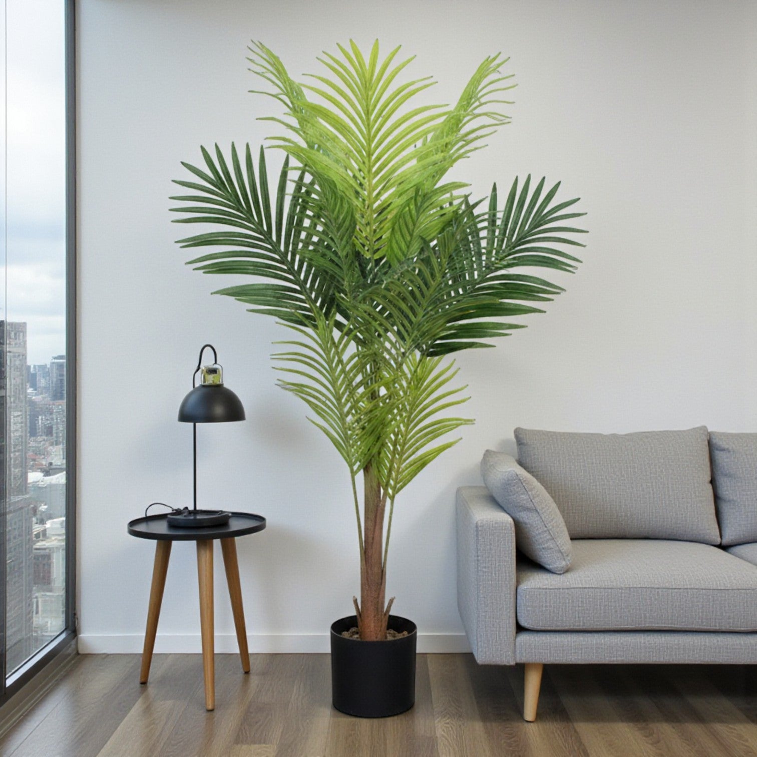 A single artificial Areca Palm leaf with detailed green fronds and a textured brown stem against a white background.