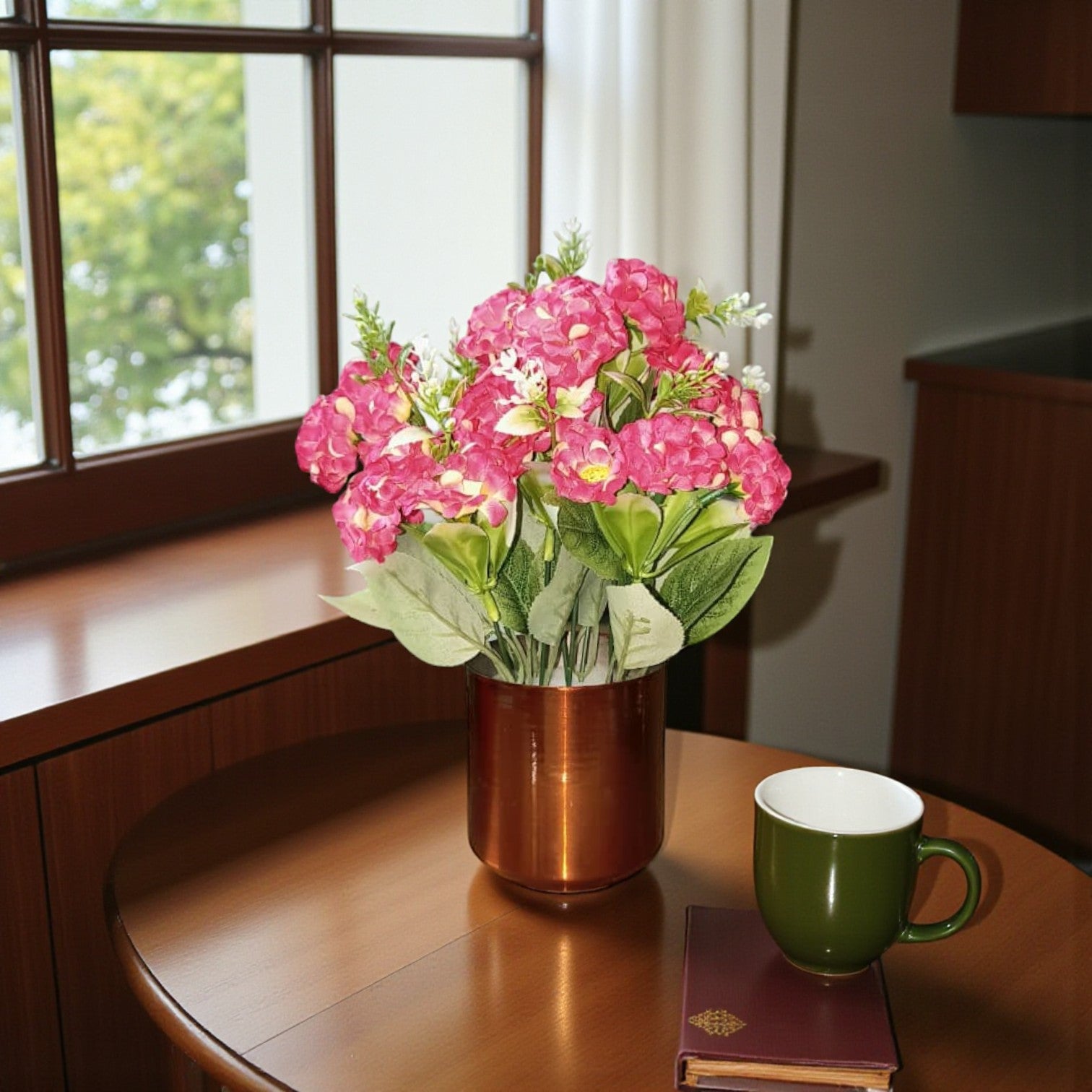 Pink artificial hydrangea flowers in a cylindrical copper metal pot for home decor.